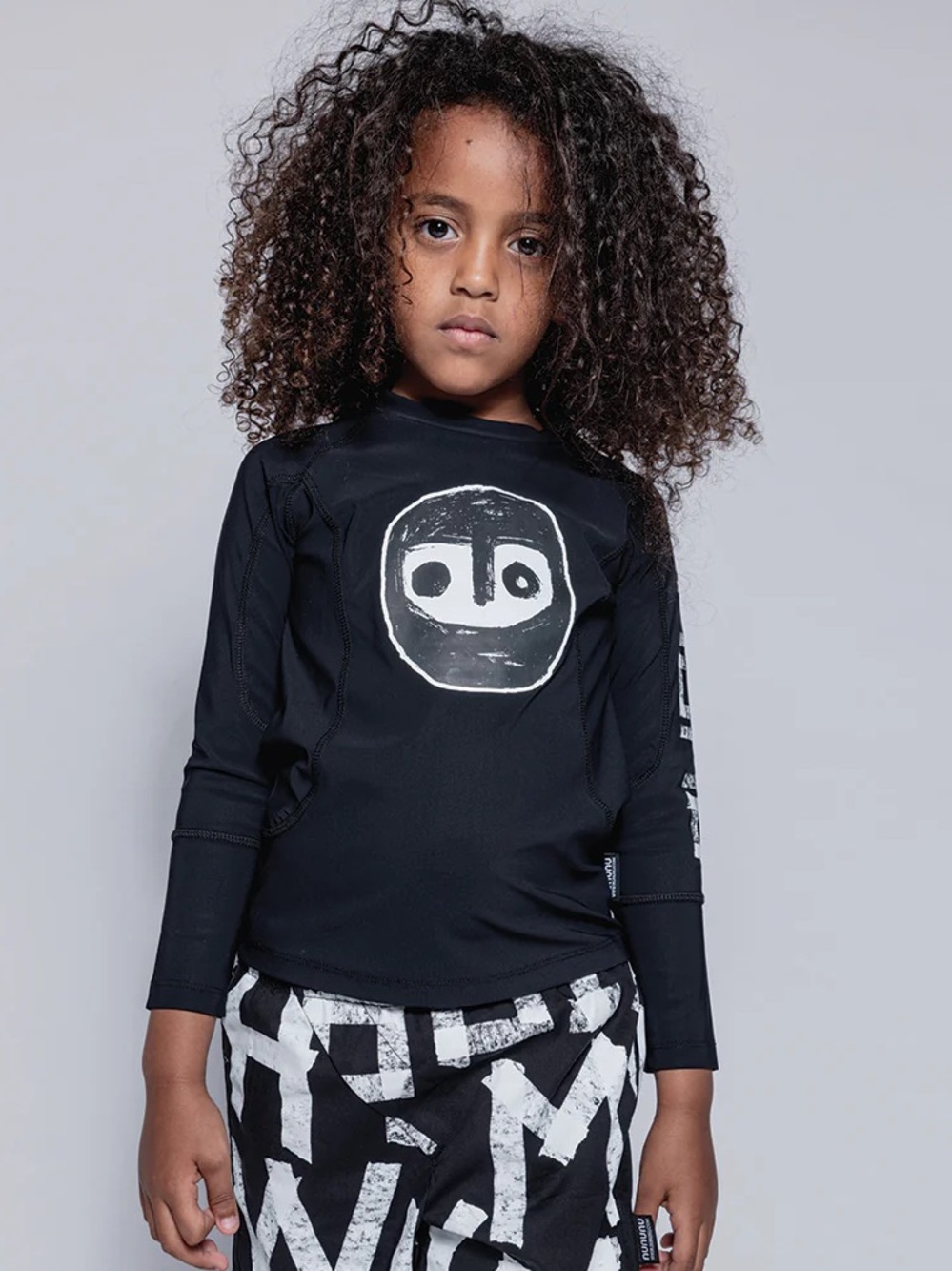 Nununu Warrior Long Sleeve Rashguard, Black with White Mask Logo, Size 10-11